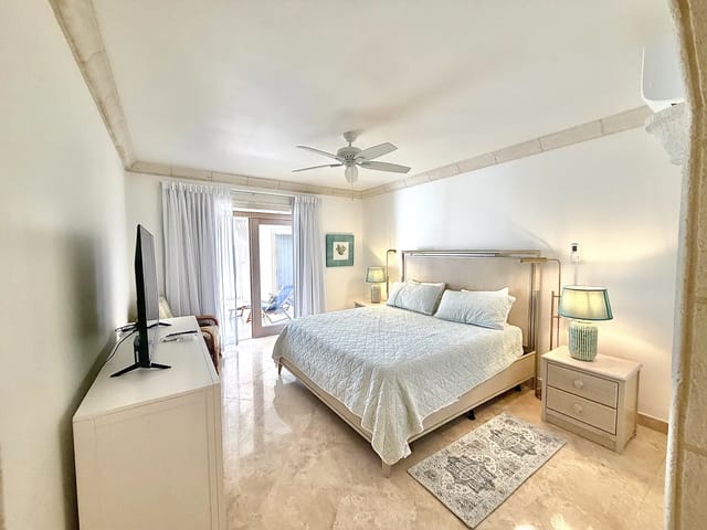 Cozy bedroom with warm lighting at Saint Peter's Bay apartment